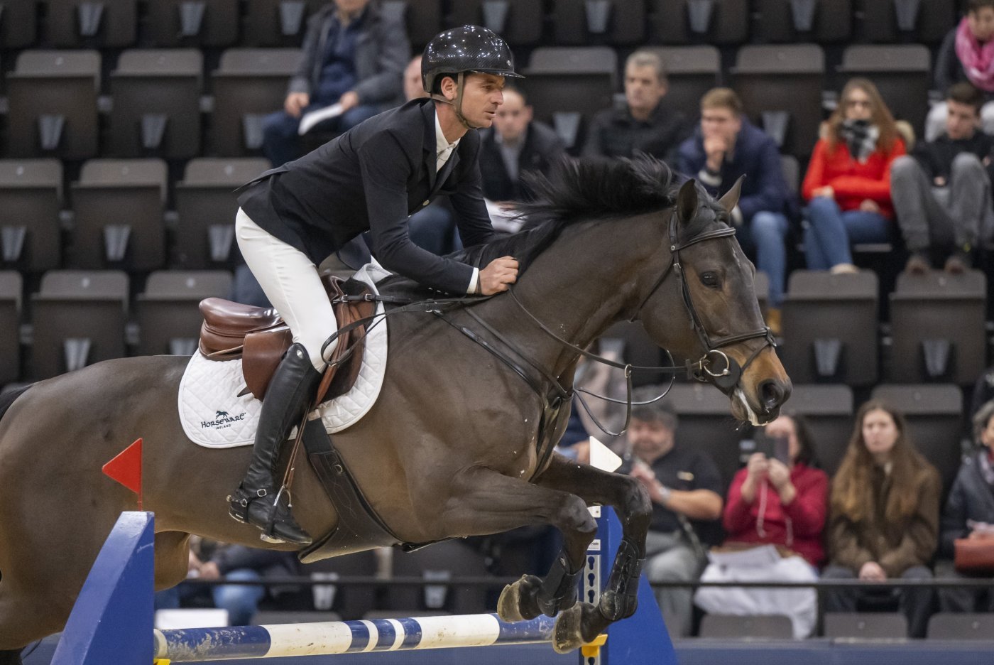 Switzerland's Steve Guerdat rides Lancelotta during the jumping competition prize of Thermoplan at the CHI Classics Basel international horse show at the St. Jakobshalle in Basel, Switzerland, on Thursday, January 11, 2024. (KEYSTONE/Georgios Kefalas)