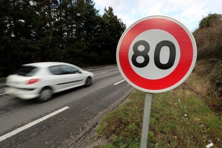 epa06857455 (FILE) - A vehicle passes a speed limit sign of 80 kilometers per hour (kph) on a road in Tain-l'Hermitage, southern France, 05 January 2018 (re-issued 02 July 2018). Reports on 02 July 2018 state the French government has reduced the speed limit on France's secondary roads to 80 kph on 01 July 2018. The government imposed the speed limit on some 40 per cent of roads that saw 55 per cent of fatal road accidents happen in 2017. The old speed limit was 90 km/h. EPA/SEBASTIEN NOGIER