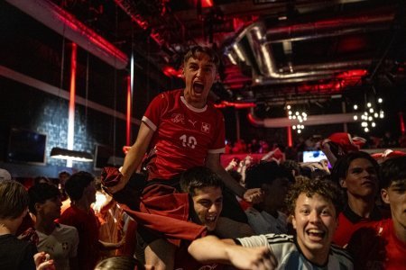 Swiss fans cheer as they watch the 2026 FIFA World Cup soccer round of 16 soccer match between Switzerland and Colombia at the public viewing in the Maag Music Hall in Zurich, Switzerland on Tuesday, July 7, 2026. (KEYSTONE/Claudio Thoma)